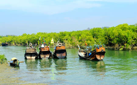 Traditional Fishing Boat Stand on Beautiful Riverの写真素材