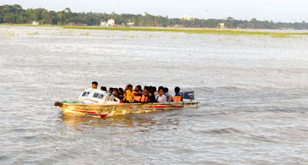 People Transportation in river by speedboat,Small Boat,The photo was taken from Padma River,Maoa,Dhaka on 18 th October 2020.のeditorial素材