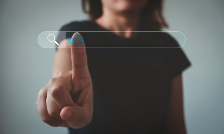 Woman hand touching on search bar for Search Engine Optimization or SEO concept to find information or data with ai technology by internet connection. internet, network, database, information system.の写真素材