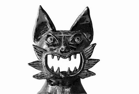 Black-and-white laughing cat of ceramics.の写真素材