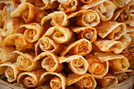 A big basket with rosy cookies.の写真素材
