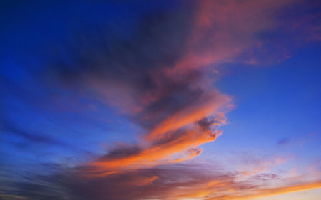A cloud of fire vortex at sunset in the background of the sky 