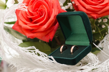 wedding rings and roses bouquetの写真素材