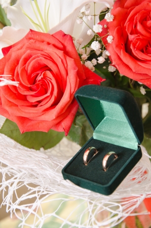 wedding rings and roses bouquetの写真素材