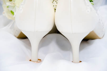 Wedding rings and high heel sandalの写真素材