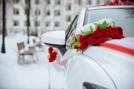 Beautiful red wedding bouquet on the carの写真素材