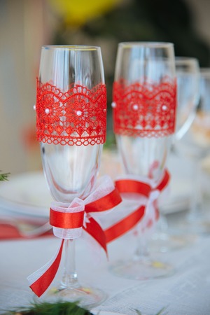 two decorative champagne glasses on the tableの写真素材