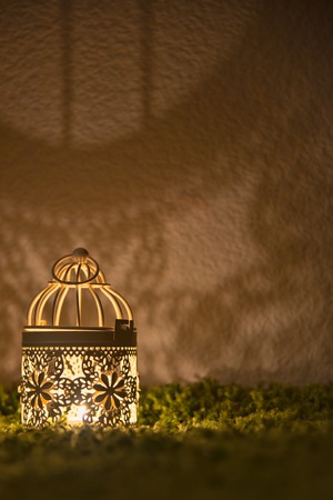 grunge textured picture of a desk lamp shining on a dark wallの写真素材