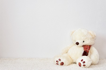 White wall texture with a white bearの写真素材