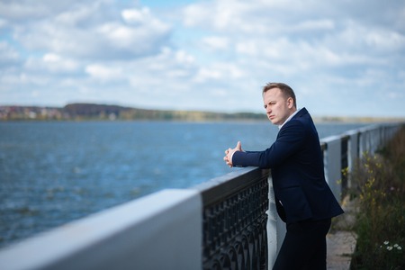 portrait of middle aged businessman walking in the natureの写真素材