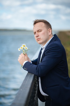 portrait of middle aged businessman walking in the natureの写真素材