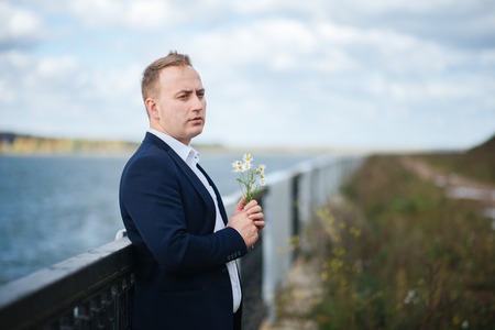 portrait of middle aged businessman walking in the natureの写真素材