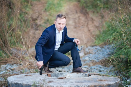 portrait of middle aged businessman walking in the natureの写真素材