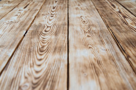 wooden texture with natural pattern and veins, stained a brown colorの写真素材