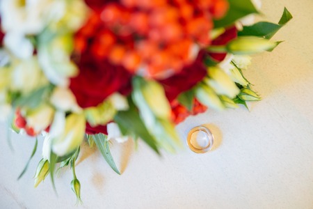 Beautiful wedding colorful bouquet for bride. Beauty of colored flowers. Close-up bunch of florets. Bridal accessories. Female decoration for girl. Details for marriage and for married coupleの写真素材