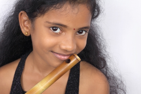Portrait of Indian Girl with Fluteの写真素材