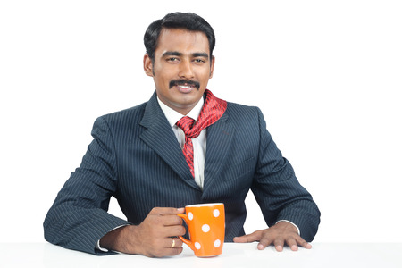 Indian Businessman with coffee cupの写真素材