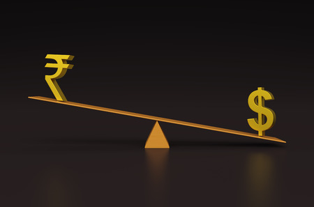 Balancing with Dollar and Rupeeの写真素材