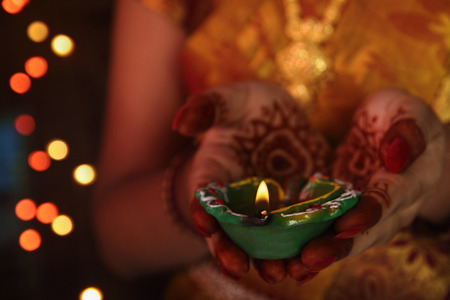 Indian girl holding Oil Lampの写真素材