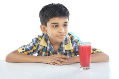 Boy with watermelon juiceの写真素材