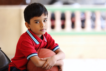 Portrait of indian boy with Basketballの写真素材