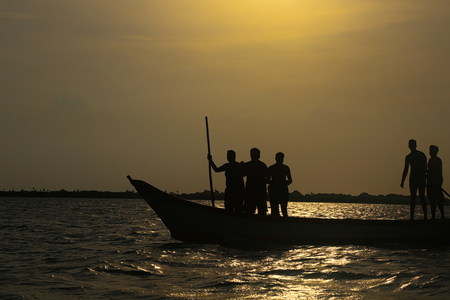 Silhouette Friends are on Boatの写真素材