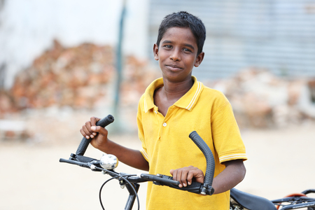 Portrait of Indian Young Boy with bicycleの写真素材