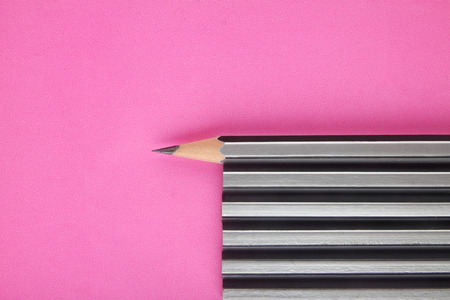 Pencil isolated on pink backgroundの写真素材