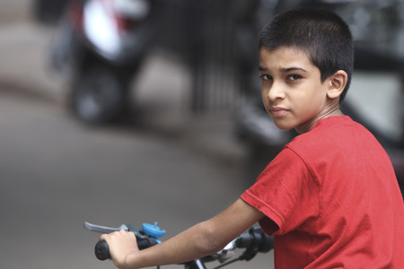 Portrait of Indian Boy with Bicycleの写真素材