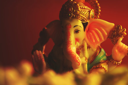 Hindu God Ganesha with jasmine flowers