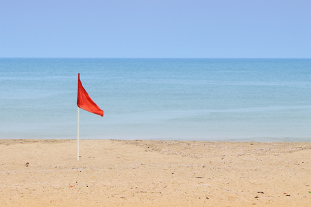 Red flag warning sign at the beachの写真素材