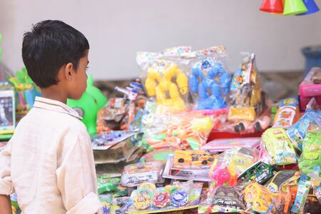 Indian Little boy buying the Toys in Toy Shopの写真素材