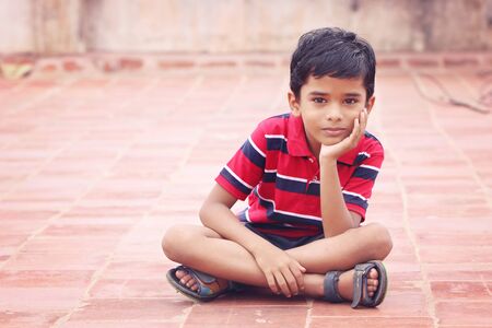 Portrait of Indian Little Boy Posing to Cameraの写真素材
