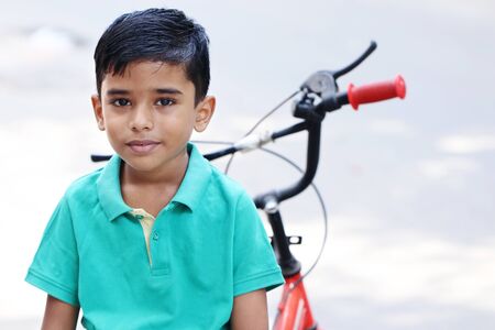 Indian Little Boy with Cycleの写真素材