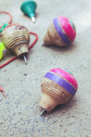 Classic wooden spinning top toy with string