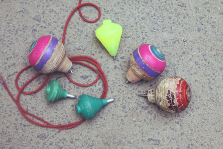 Classic wooden spinning top toy with string