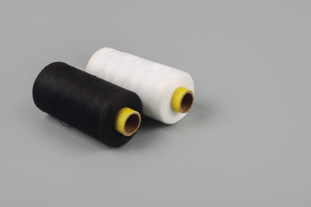 bobbin thread isolated on gray background