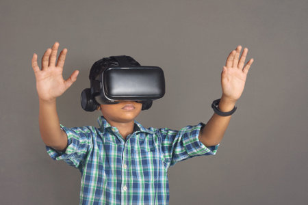 Portrait of Indian little boy wearing Virtual Reality Glasses