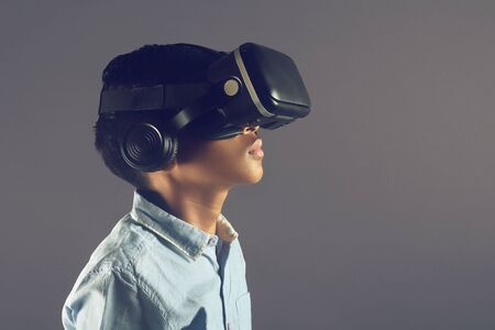Portrait of Indian young boy wearing Virtual Reality Glassesの写真素材