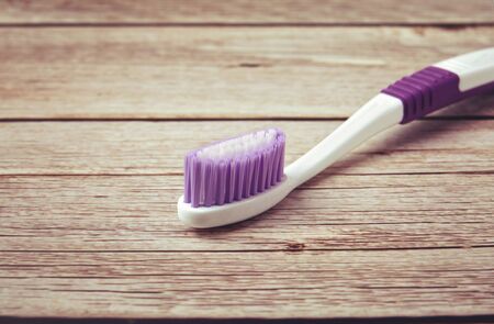 Tooth brush isolated on wooden tableの写真素材