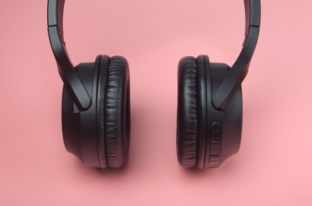 Wireless headphone on pink background