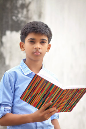 Portrait of Indian little school boy posing to camera