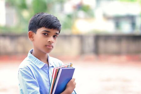 Portrait of Indian little school boy posing to cameraの写真素材