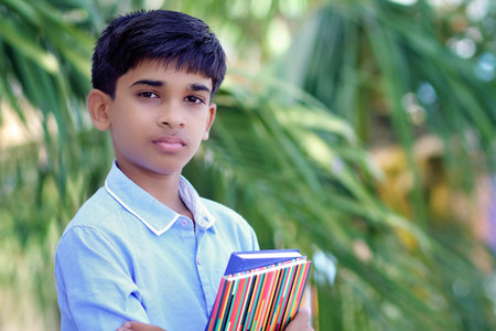 Portrait of Indian little school boy posing to camera