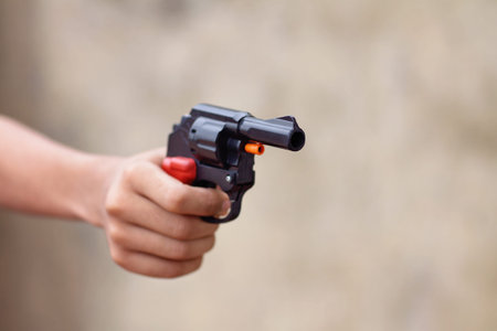 Little boy holding the toy gun on Diwali Occasion