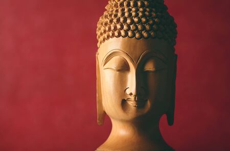 Portrait of Wooden Buddha statueの写真素材