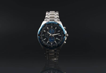 Men's wrist metal watch on black backgroundの写真素材