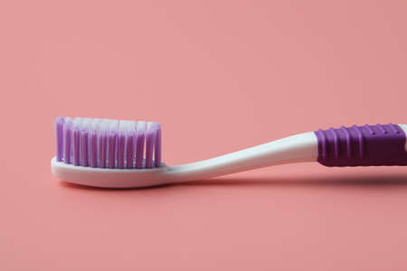 Tooth brush isolated on pink backgroundの写真素材