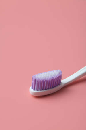 Tooth brush isolated on pink backgroundの写真素材