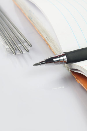 Mechanical pencil with leads on notebook